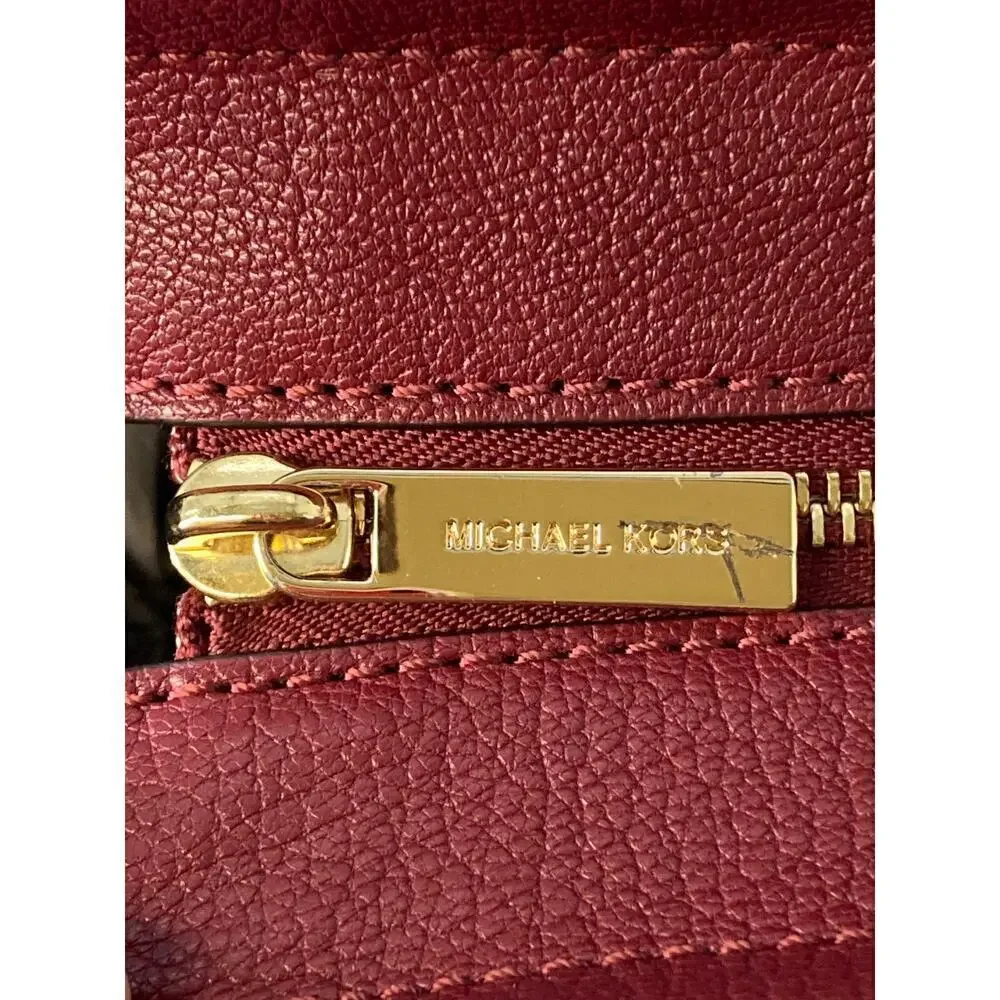 MICHAEL KORS, LARGE WINE LEATHER HANDBAG WITH LOCK CHARM.